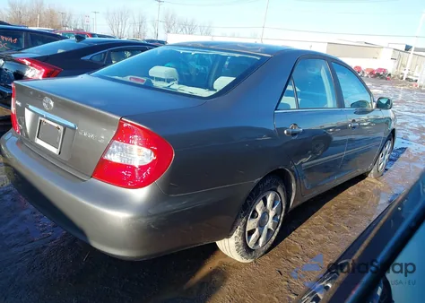 2004 Toyota Camry Le z USA, uszkodzony, nr VIN 4T1BE32K84U918826